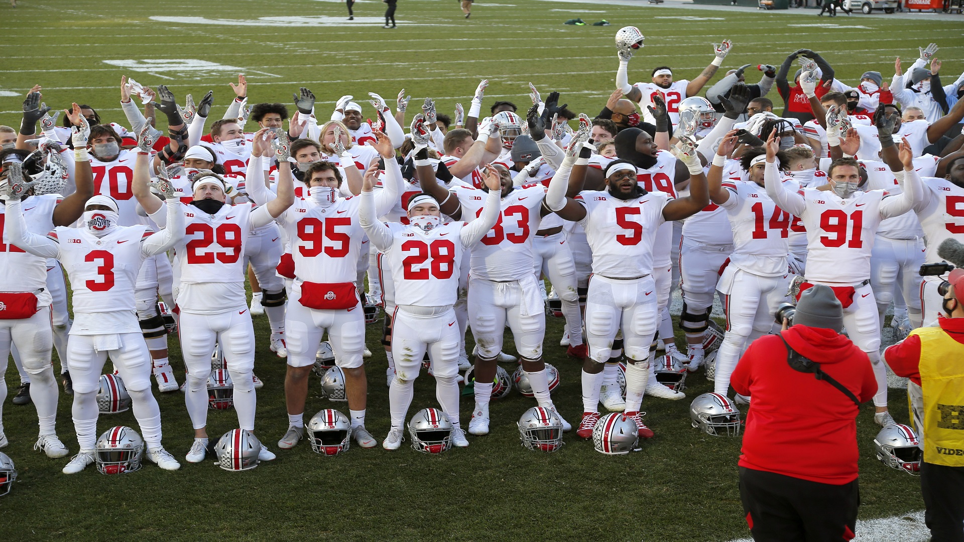 A group of football players celebrating.